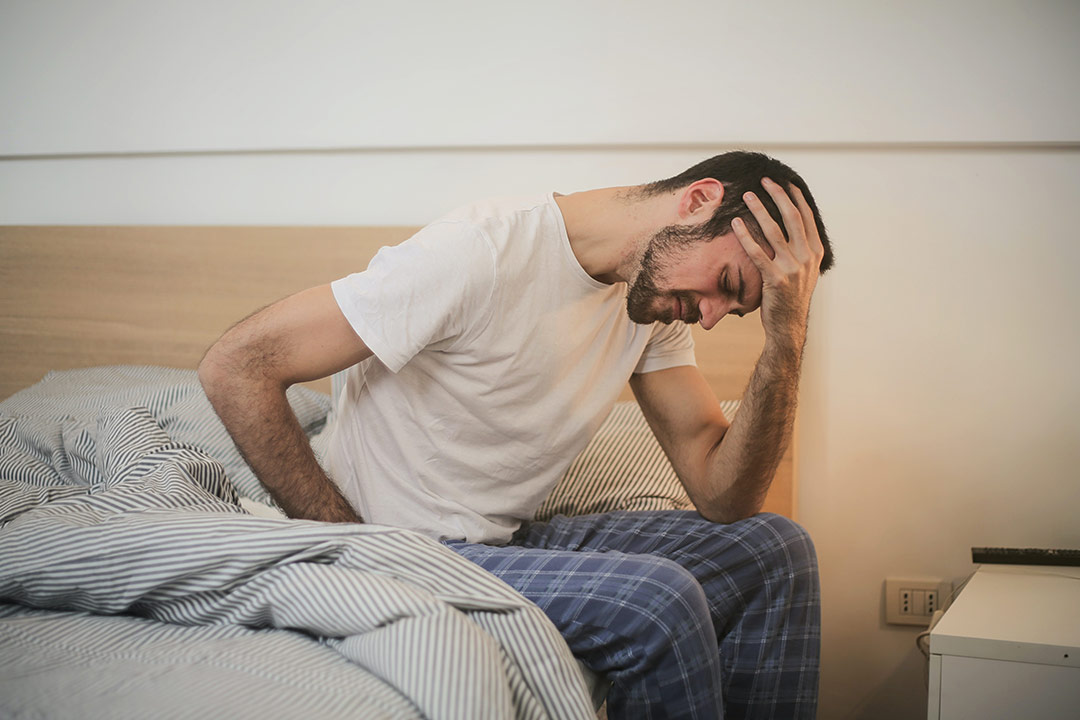 Man waking up with back pain
